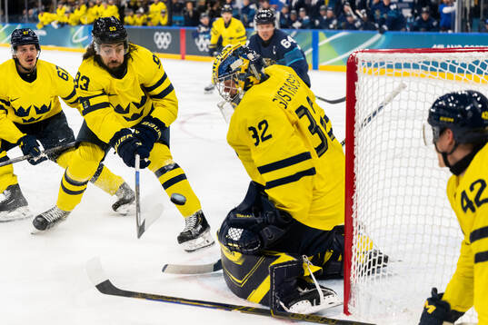 Mika Zibanejad and goaltender Filip Gustavsson of Sweden in