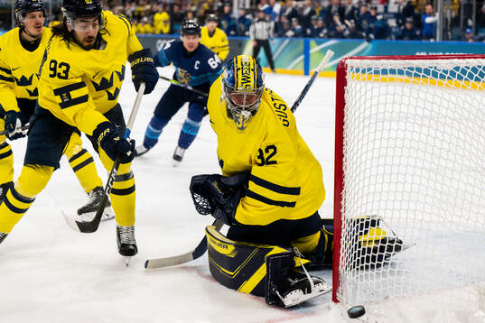 Mika Zibanejad and goaltender Filip Gustavsson of Sweden in