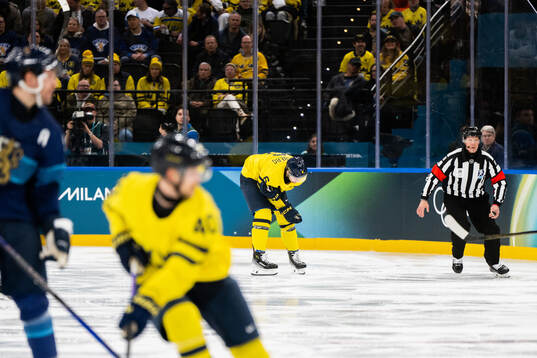 Philip Broberg of Sweden is in pain in the men's ice hockey