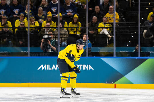 Philip Broberg of Sweden is in pain in the men's ice hockey