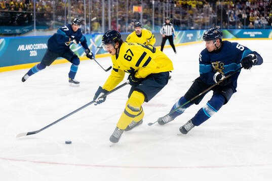 Rickard Rakell of Sweden and Rasmus Ristolainen of Finland