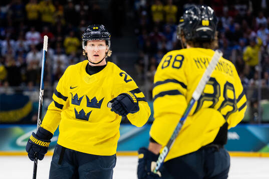 Rasmus Dahlin and William Nylander of Sweden celebrate