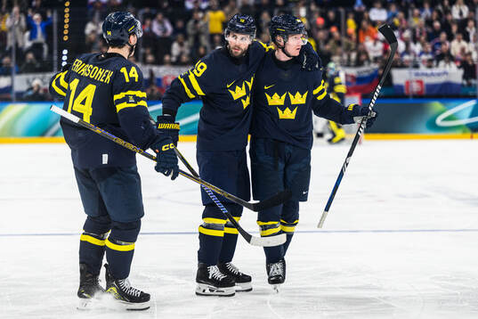 Adrian Kempe and Rasmus Dahlin of Sweden celebrate 2-1 in