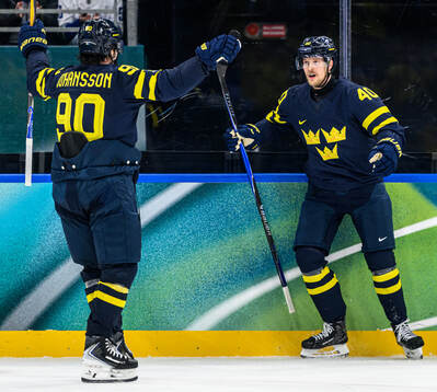 Elias Pettersson of Sweden celebrates 3-2 in the men's ice