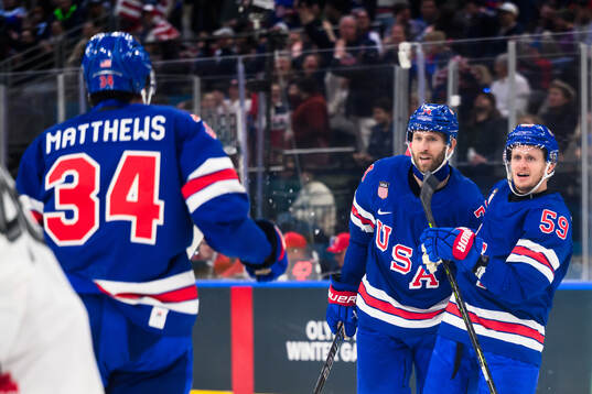 Jake Guentzel and Jaccob Slavin of USA celebrate