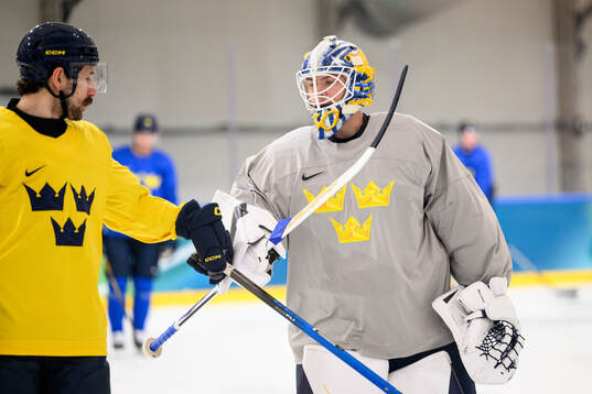 Filip Forsberg and goaltender Jesper Wallstedt of Sweden at