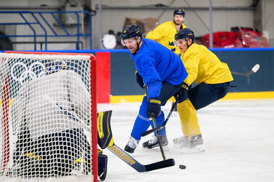 Gabriel Landeskog and Pontus Holmberg of Sweden at an ice