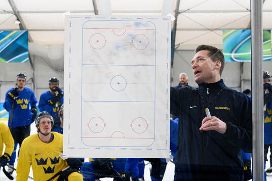Head coach Sam Hallam of Sweden at an ice hockey practice