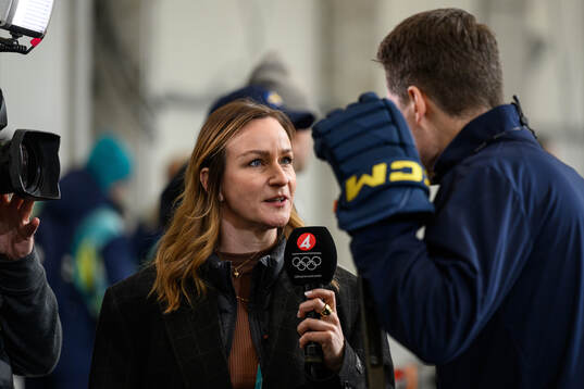 Lena Sundqvist of Swedish broadcaster TV4 with head coach
