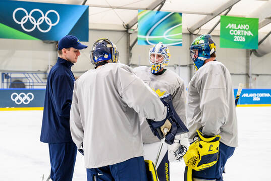 Goalie coach Anthon Hansson with goaltender Filip