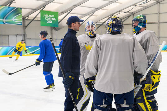 Goalie coach Anthon Hansson with goaltender Filip