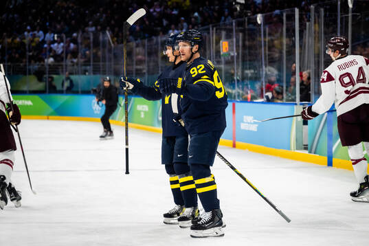 Gustav Forsling and Gabriel Landeskog of Sweden celebrate