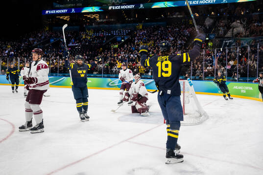 Adrian Kempe and William Nylander of Sweden celebrate
