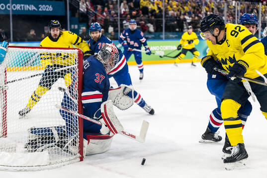Goaltender Connor Hellebuyck of USA and Gabriel Landeskog