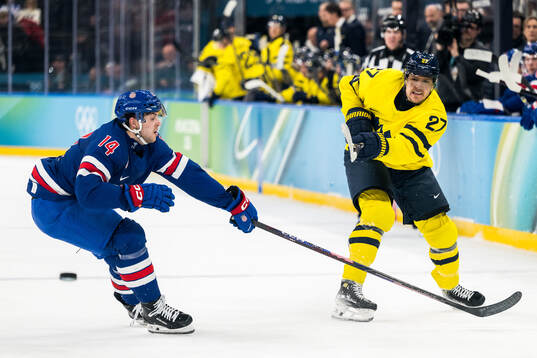 Brock Faber of USA and Hampus Lindholm of Sweden in the