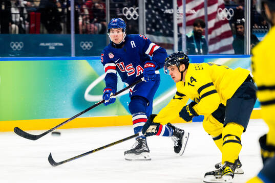 Charlie McAvoy of USA and Joel Eriksson Ek of Sweden in the