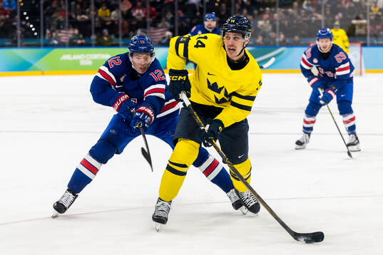 Matt Boldy of USA and Joel Eriksson Ek of Sweden in the
