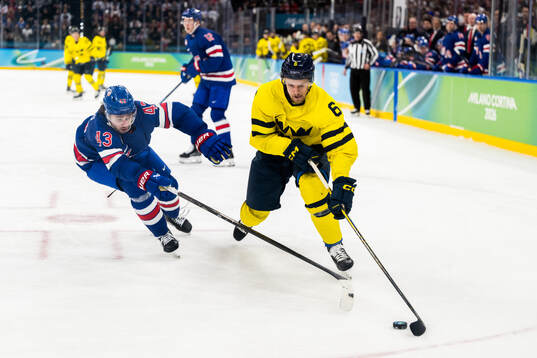 Quinn Hughes of USA and Philip Broberg of Sweden in the