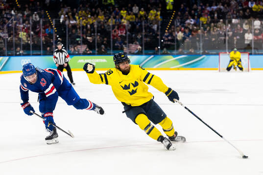 Quinn Hughes of USA and William Nylander of Sweden in the