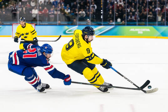 Dylan Larkin of USA and Filip Forsberg of Sweden in the