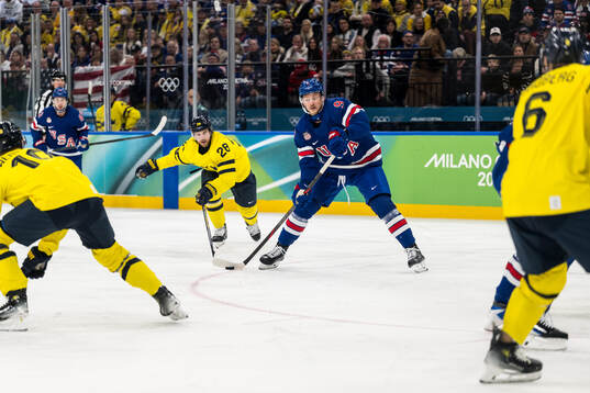 Elias Lindholm of Sweden and Jack Eichel of USA in the