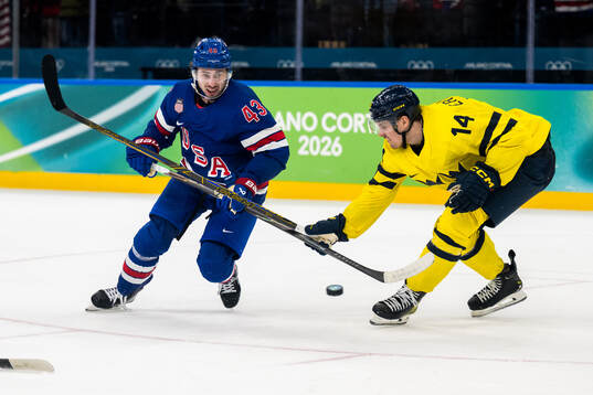 Quinn Hughes of USA and Joel Eriksson Ek of Sweden in the