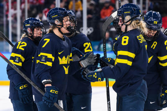 Mira Jungåker and Hilda Svensson of Sweden celebrate 0-1