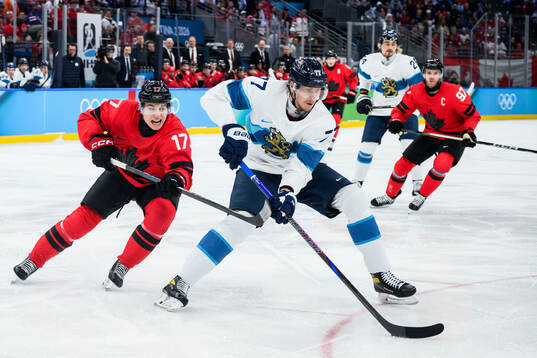 Macklin Celebrini of Canada and Niko Mikkola of Finland in