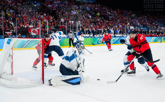 Goaltender Juuse Saros of Finland and Connor McDavid of
