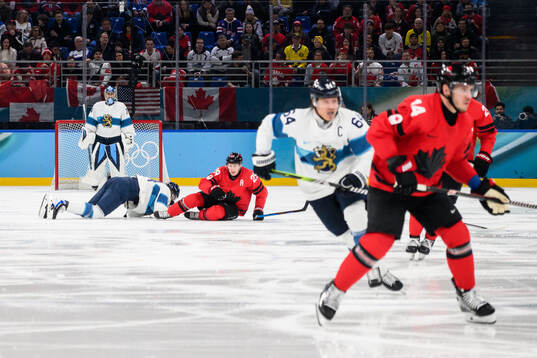 Roope Hintz of Finland and Nathan MacKinnon of Canada in