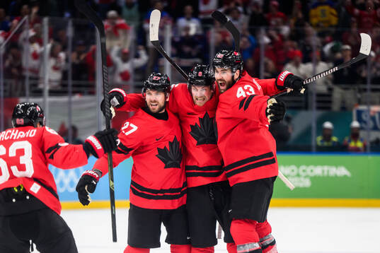 Shea Theodore, Travis Sanheim and Tom Wilson of Canada