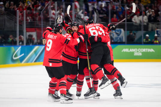 Shea Theodore, Travis Sanheim and Tom Wilson of Canada