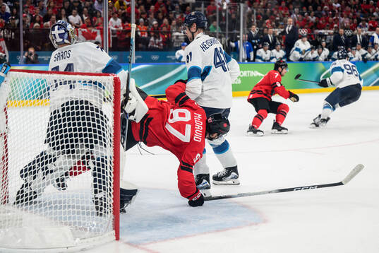 Connor McDavid of Canada against goaltender Juuse Saros and