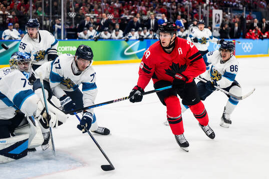 Nathan MacKinnon of Canada against Niko Mikkola, Teuvo
