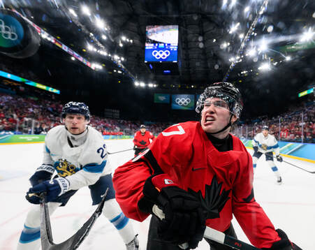 Macklin Celebrini of Canada and Esa Lindell of Finland in