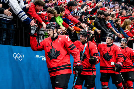 Nathan MacKinnon of Canada celebrate with fans