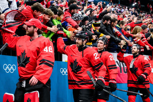 Shea Theodore of Canada celebrate with fans