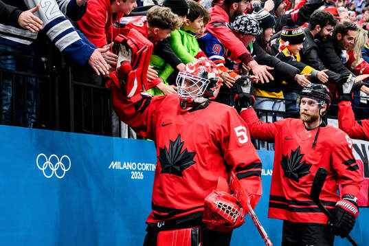 Goaltender Jordan Binnington of Canada celebrate with fans