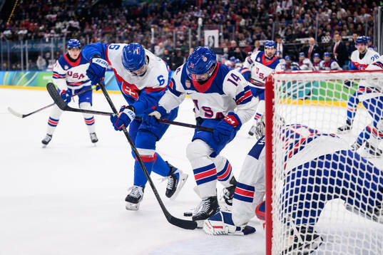 Lukas Cingel of Slovakia against Brock Faber and goaltender