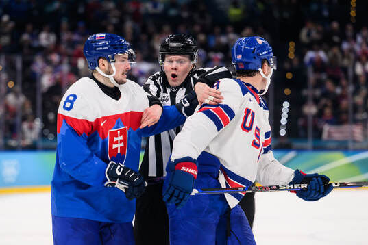 Oliver Okuliar of Slovakia and Matthew Tkachuk of USA in