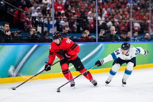 Mitch Marner of Canada and Mikael Granlund of Finland in