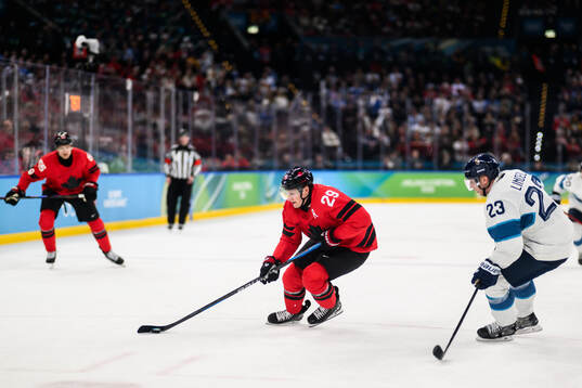Nathan MacKinnon of Canada and Esa Lindell of Finland in