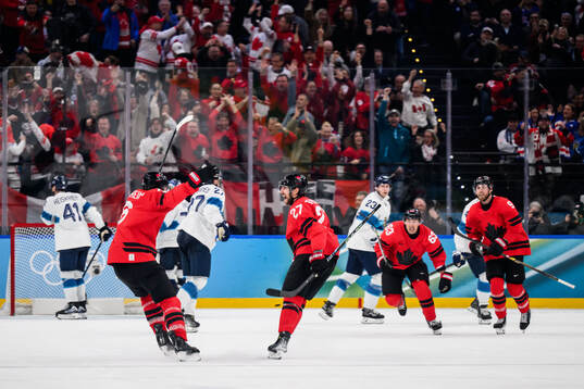 Travis Sanheim, Shea Theodore, Brad Marchand and Sam