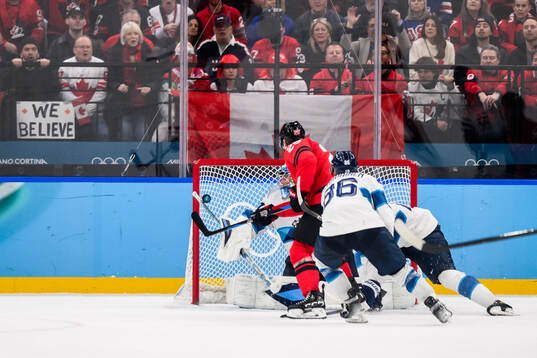 Nathan MacKinnon of Canada against goaltender Juuse Saros