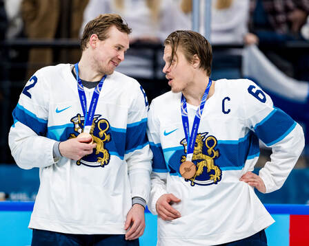 Artturi Lehkonen and Mikael Granlund of Finland with their