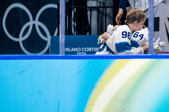 Mikko Rantanen and Mikael Granlund of Finland celebrate