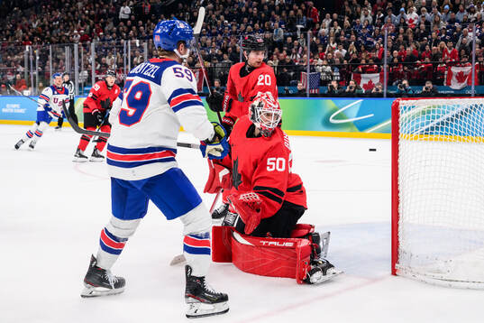 Jake Guentzel of USA against Thomas Harley and goaltender