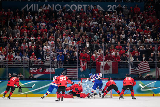 Goaltender Jordan Binnington of Canada and Matthew Tkachuk