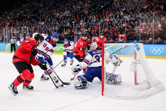 Macklin Celebrini of Canada against Jaccob Slavin and