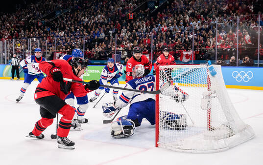 Macklin Celebrini of Canada against Jaccob Slavin and